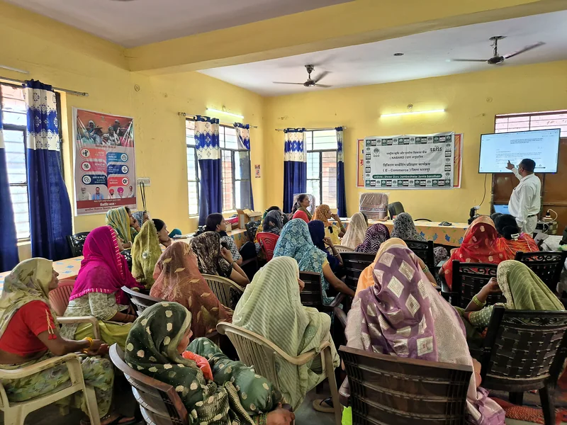 Women SHG members attending a screen-led digital marketing training session at Khanua village, Bharatpur.